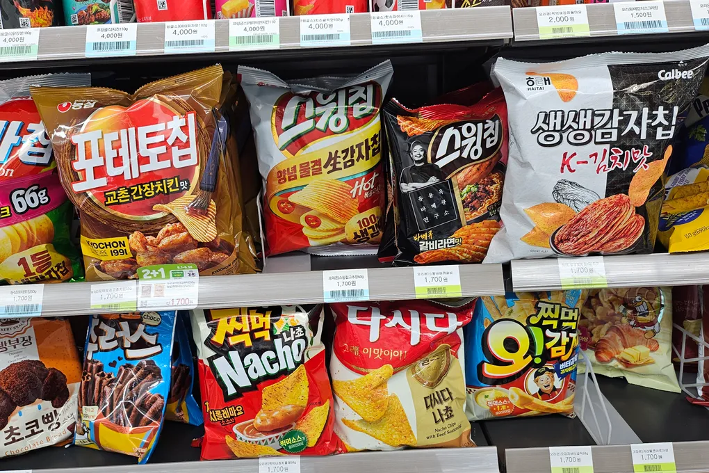 Storefront of a CU convenience store in Itaewon, Seoul, with the purple and green 'Nice to CU' sign
