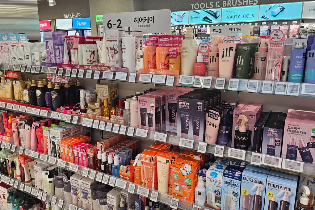 Hair care aisle at Olive Young with shampoos, treatments and styling products